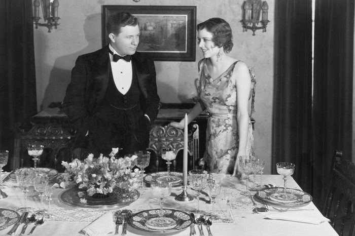 Couple with table set for dinner
