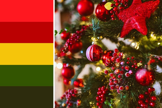close up of red decorations on a christmas tree next to a christmas color palatte inspired by the image