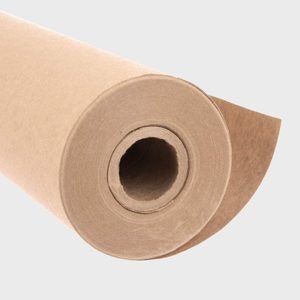 A large roll of brown kraft paper, slightly unrolled, lies against a plain, light gray background.
