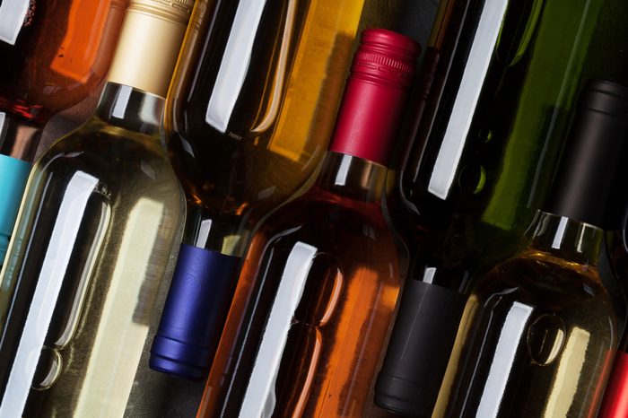 Red, rose and white wine bottles. Top view