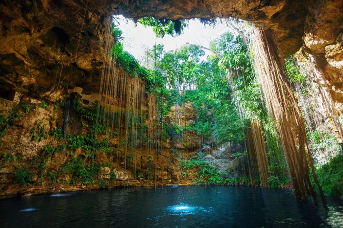 Sunbeams penetrating at Ik-Kil cenote inlet