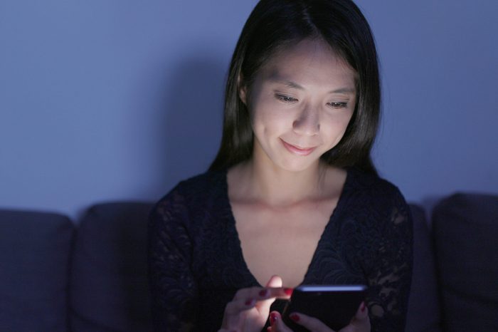 Woman use of mobile phone at home 