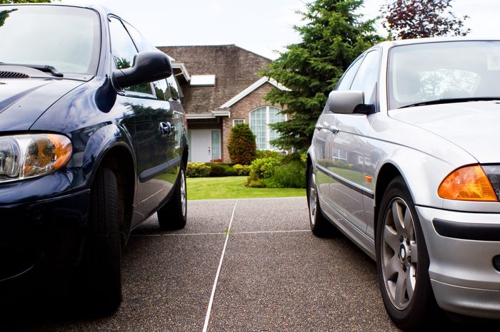modern suburban family life - 2 cars & a house