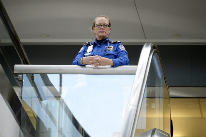 A Transportation Security Administration agent looks at travelers in Terminal 3 at Los Angeles International Airport November 2, 2013 in Los Angeles, California.