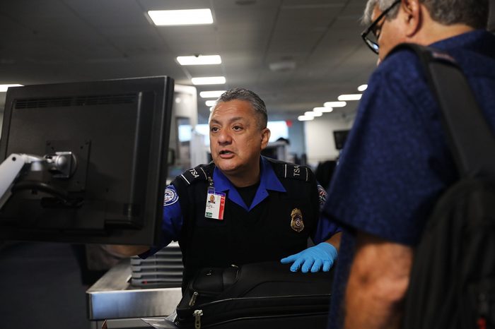 A Transportation Security Administration (TSA) worker screens luggage at LaGuardia Airport (LGA) on September 26, 2017 in New York City.