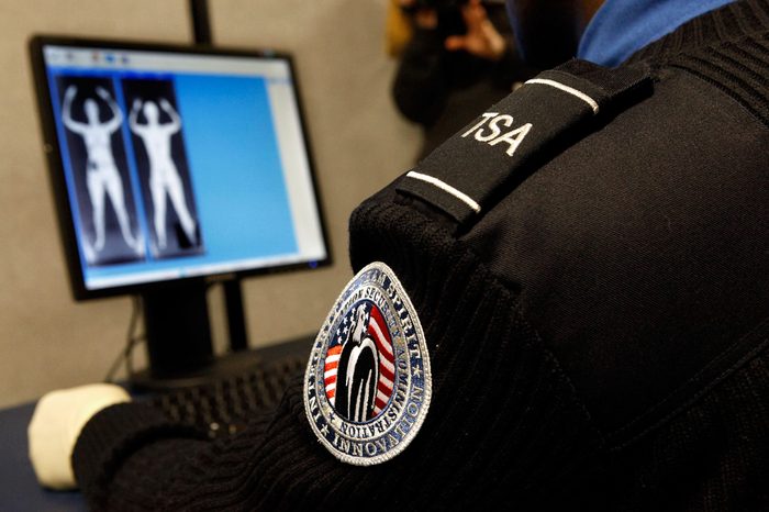 Transportation Security Administration Security Officer Nyamsi Tchapleu looks at images created by a "backscatter" scanner during a demonstration at the Transportation Security Administration's Systems Integration Facility at Ronald Reagan National Airport December 30, 2009 in Arlington, Virginia.