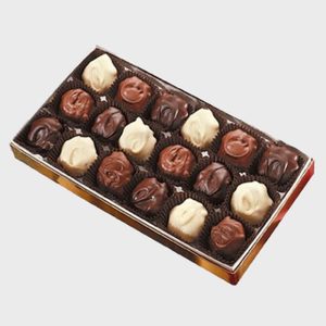 Box of assorted chocolates arranged neatly in rows, sitting in a protective brown tray within a decorative, rectangular box.