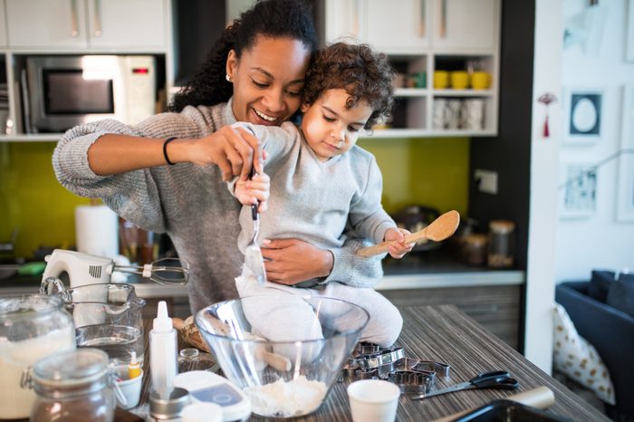 mother and cute young son baking in the kitchen