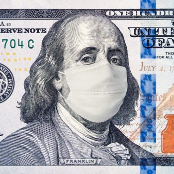 A portrait on a hundred-dollar bill wears a white mask, overlaying traditional monetary design.