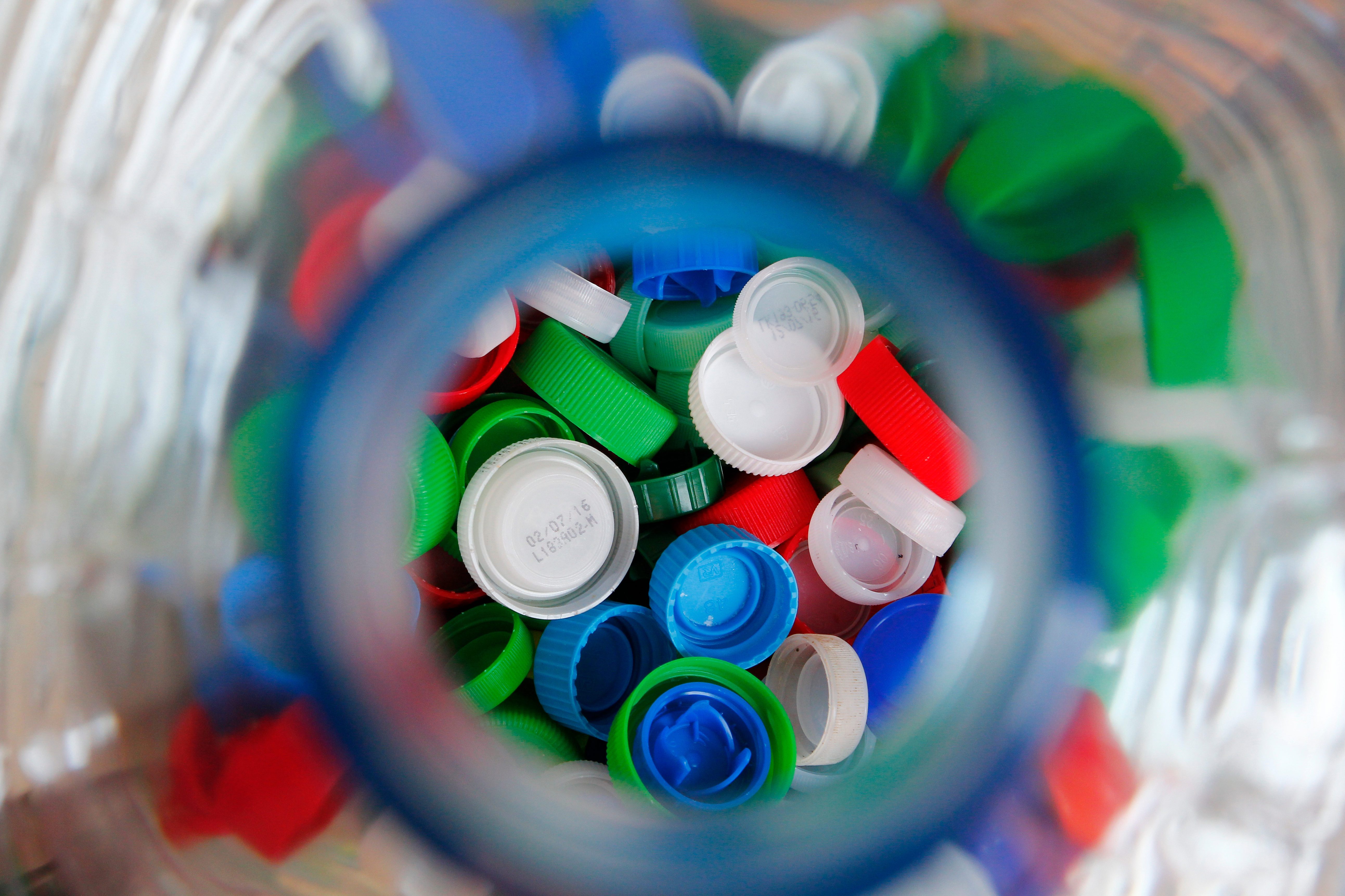 Directly Above Shot Of Multi Colored Bottle Caps