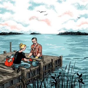 Two people fit a pipe on a wooden dock by a calm lake, surrounded by distant islands and a cloudy sky with birds flying.