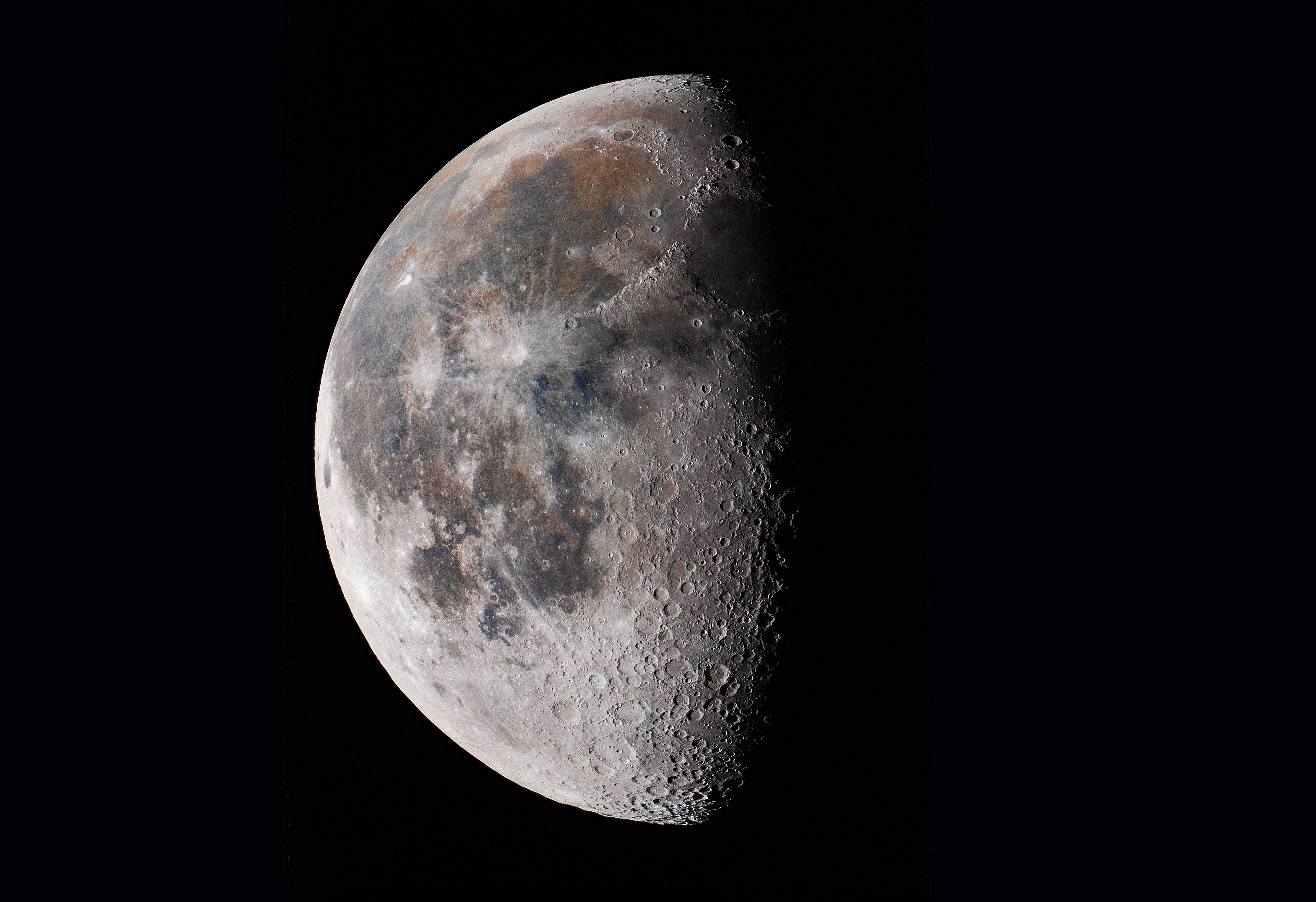 The moon displays half-illuminated, detailed craters and maria, against a dark, expansive space background.