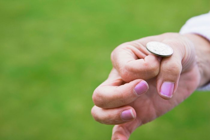 Woman flipping a coin