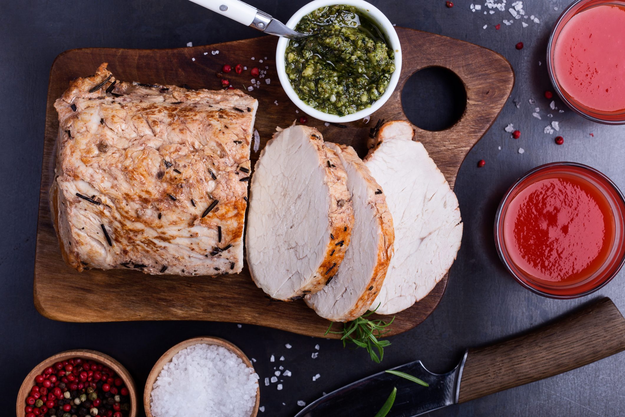 Herb roasted pork loin on cutting board