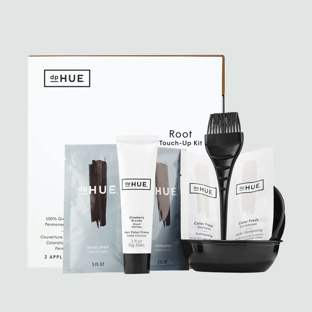 Hair color kit with brush, tubes, and packets arranged on a white box labeled 