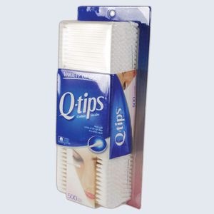 Box of Q-tips stands vertically, showing cotton swabs through a clear section, surrounded by blue and white packaging with 