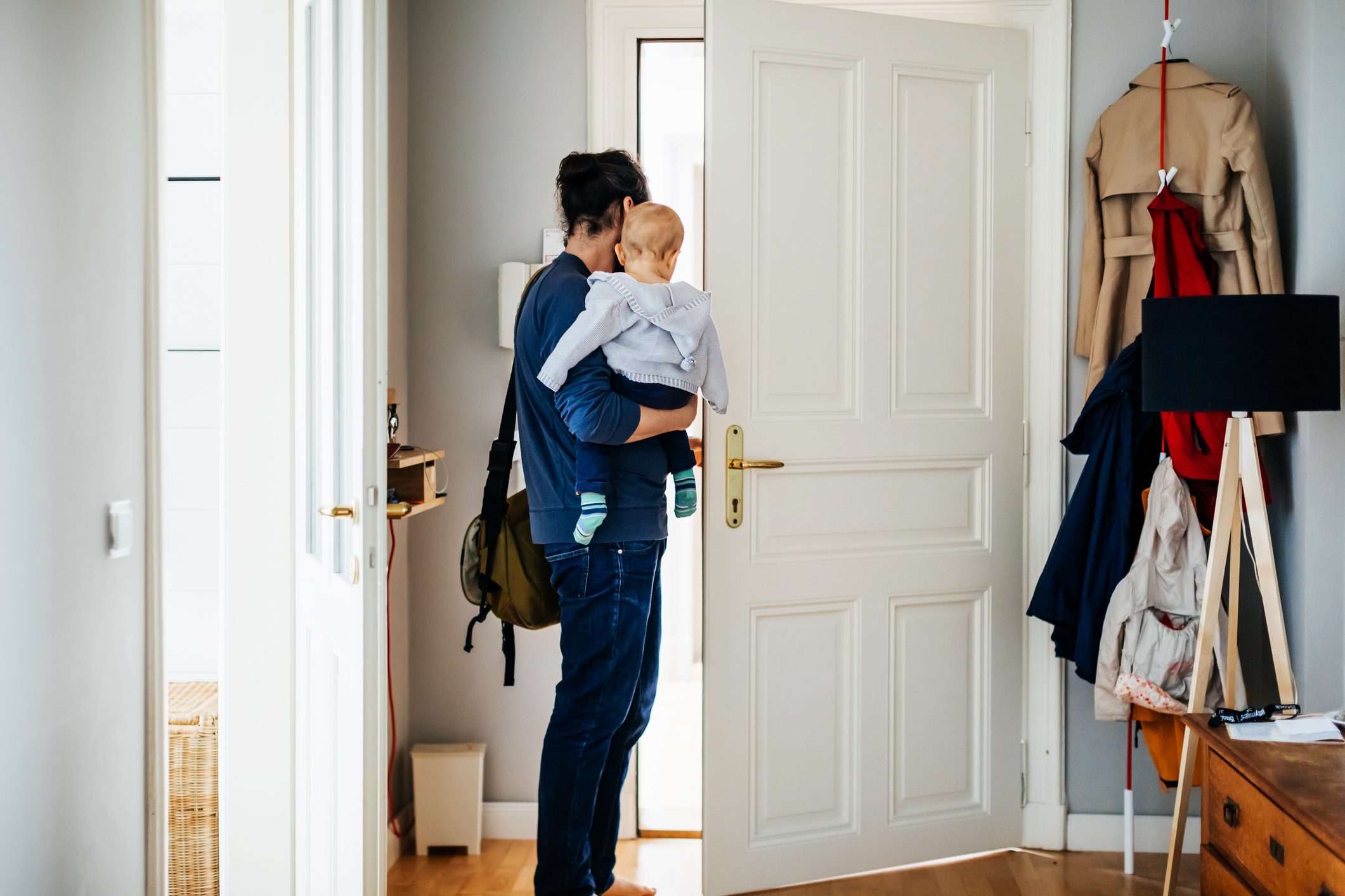 Single Father leaving House With His Baby