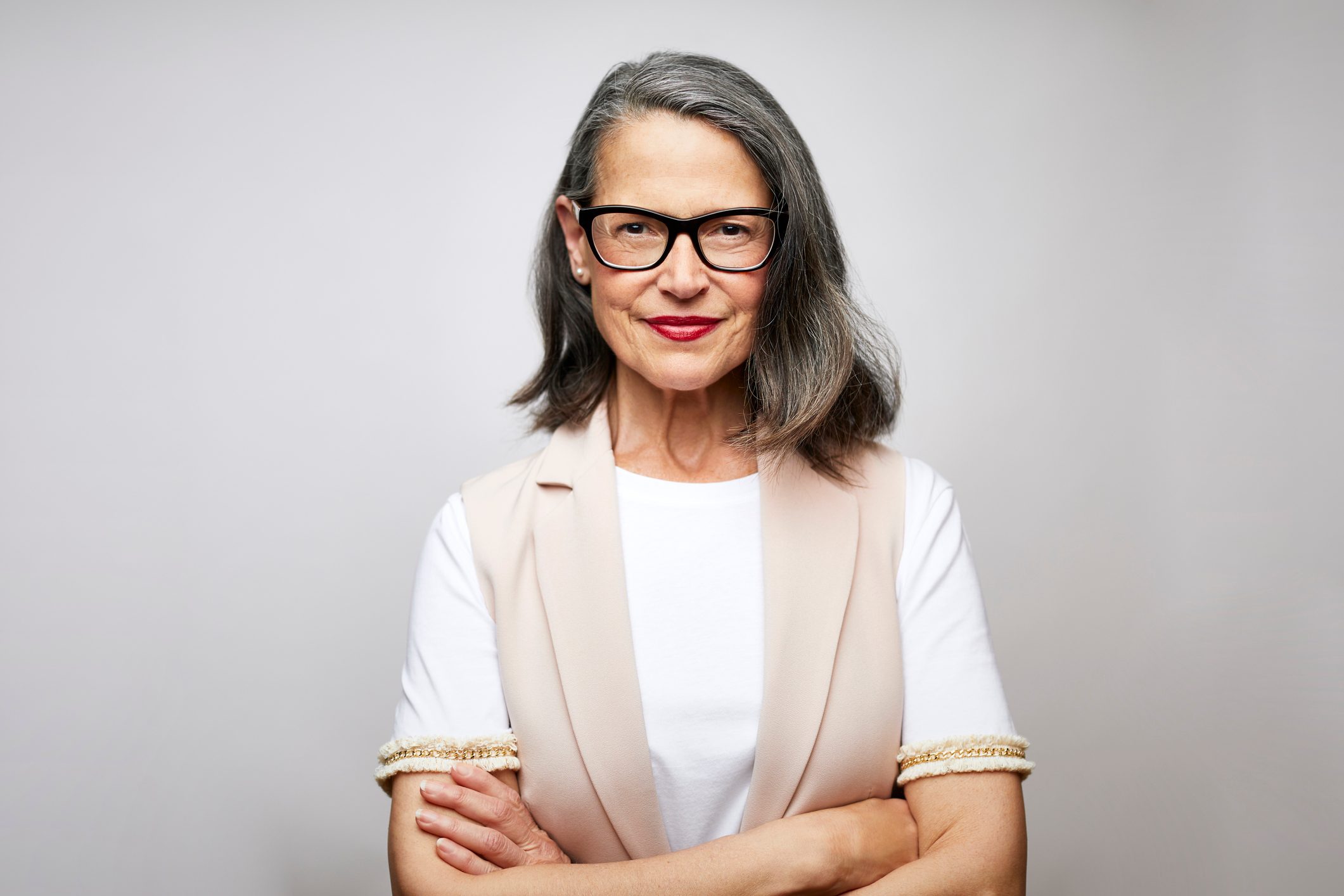 Mature female CEO with arms crossed