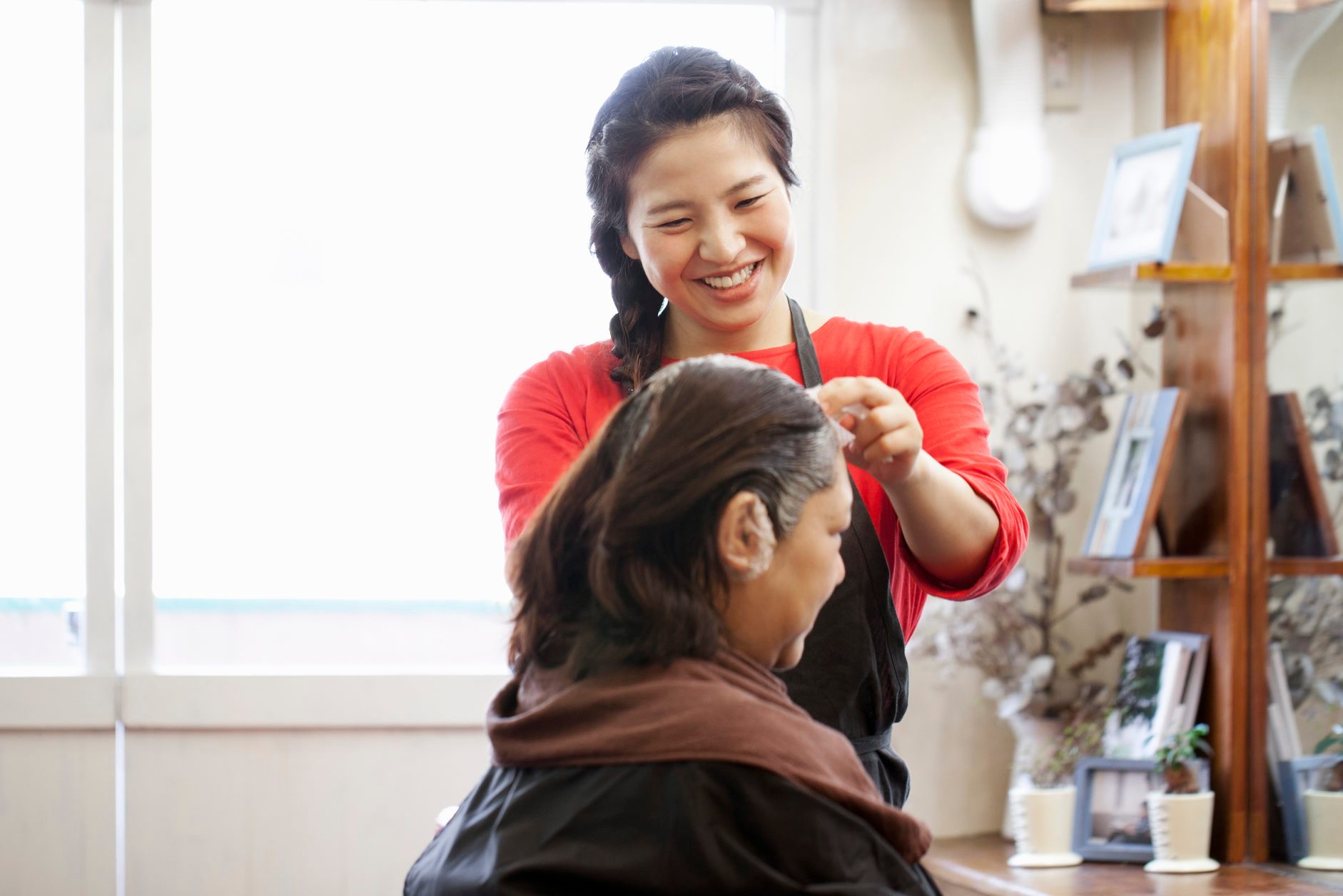 A female beautician working in a beauty salon