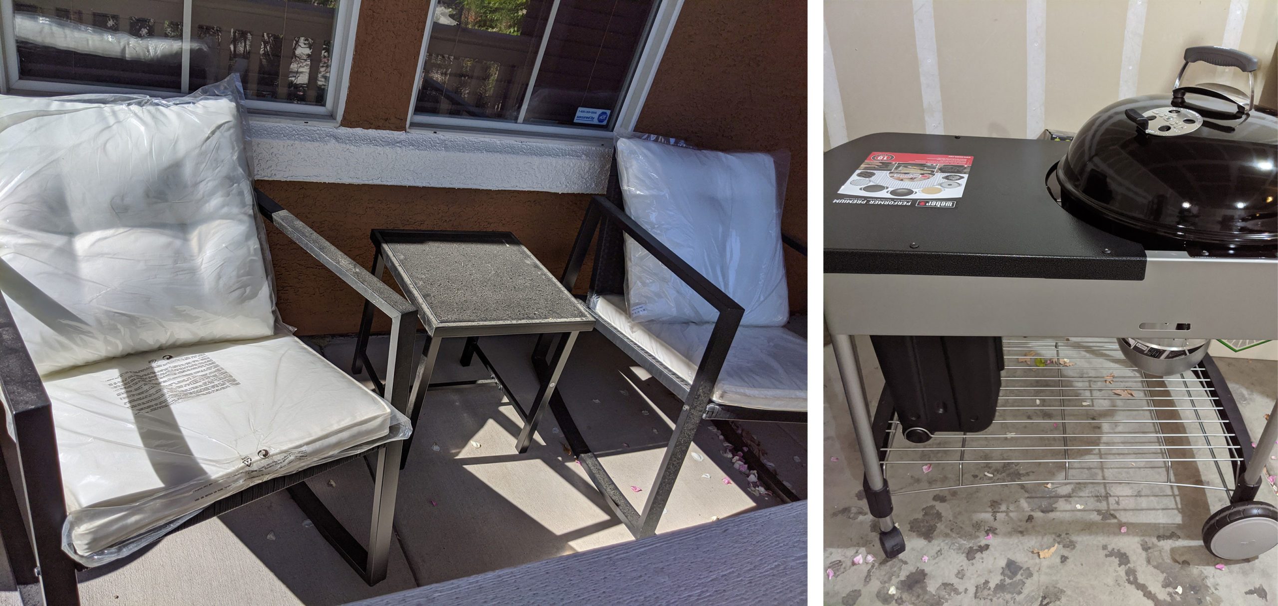 Two cushioned chairs and a small table sit on a patio. A black grill stands next to a wall in a garage setting.