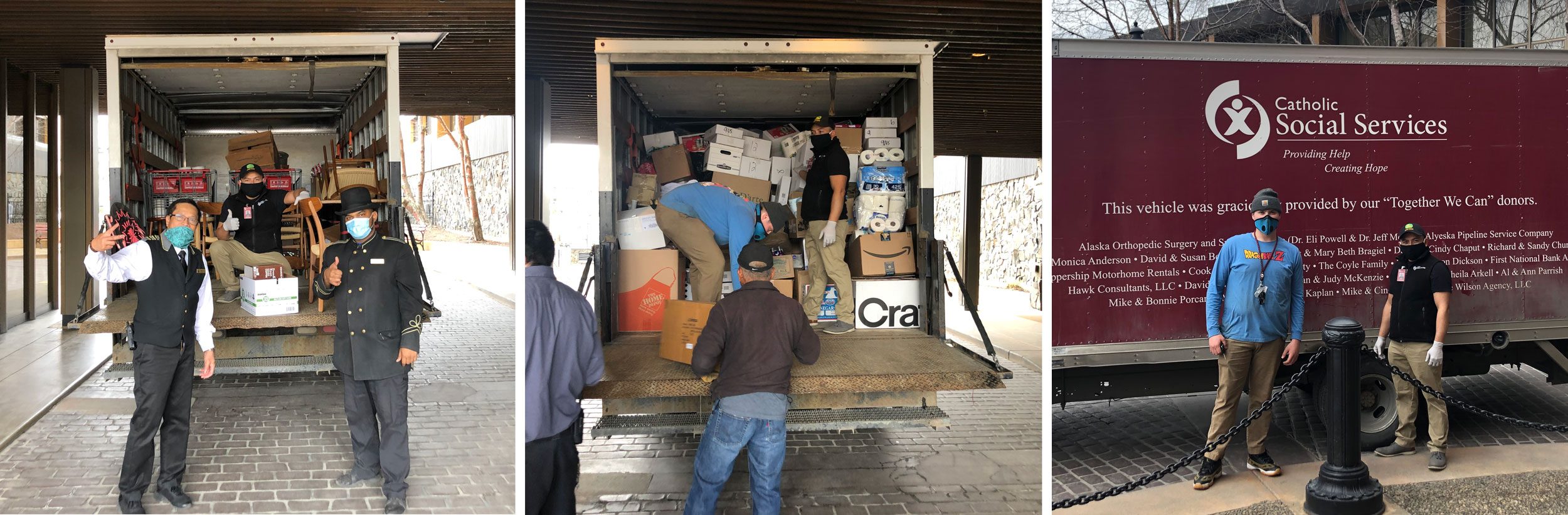 Truck loaded with boxes and supplies; people stand nearby wearing masks, showing thumbs-up gestures. Truck reads "Catholic Social Services." Urban setting.