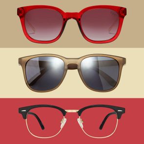 Three pairs of glasses with distinct frames appear aligned horizontally against a tri-color background of beige, cream, and red.