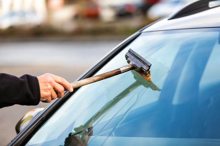 Cropped Hand Washing Car Windshield
