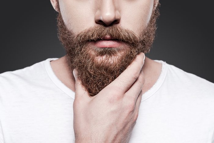 Touching his perfect beard.