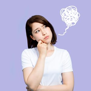 Person thinking, with a puzzled expression and hand on chin; behind them, a scribbled thought bubble; plain light purple background.