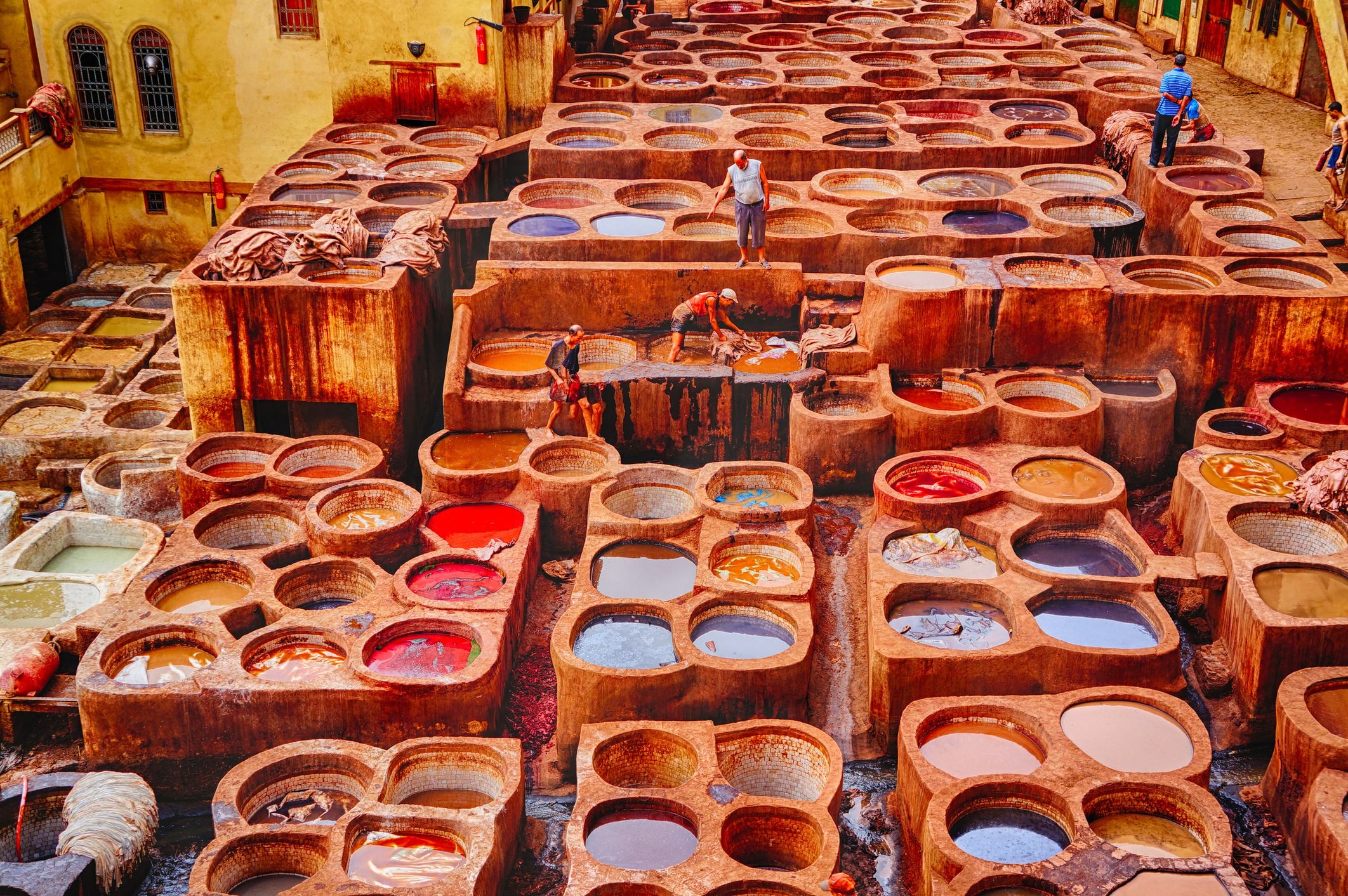 High Angle View Of People Working In Tannery