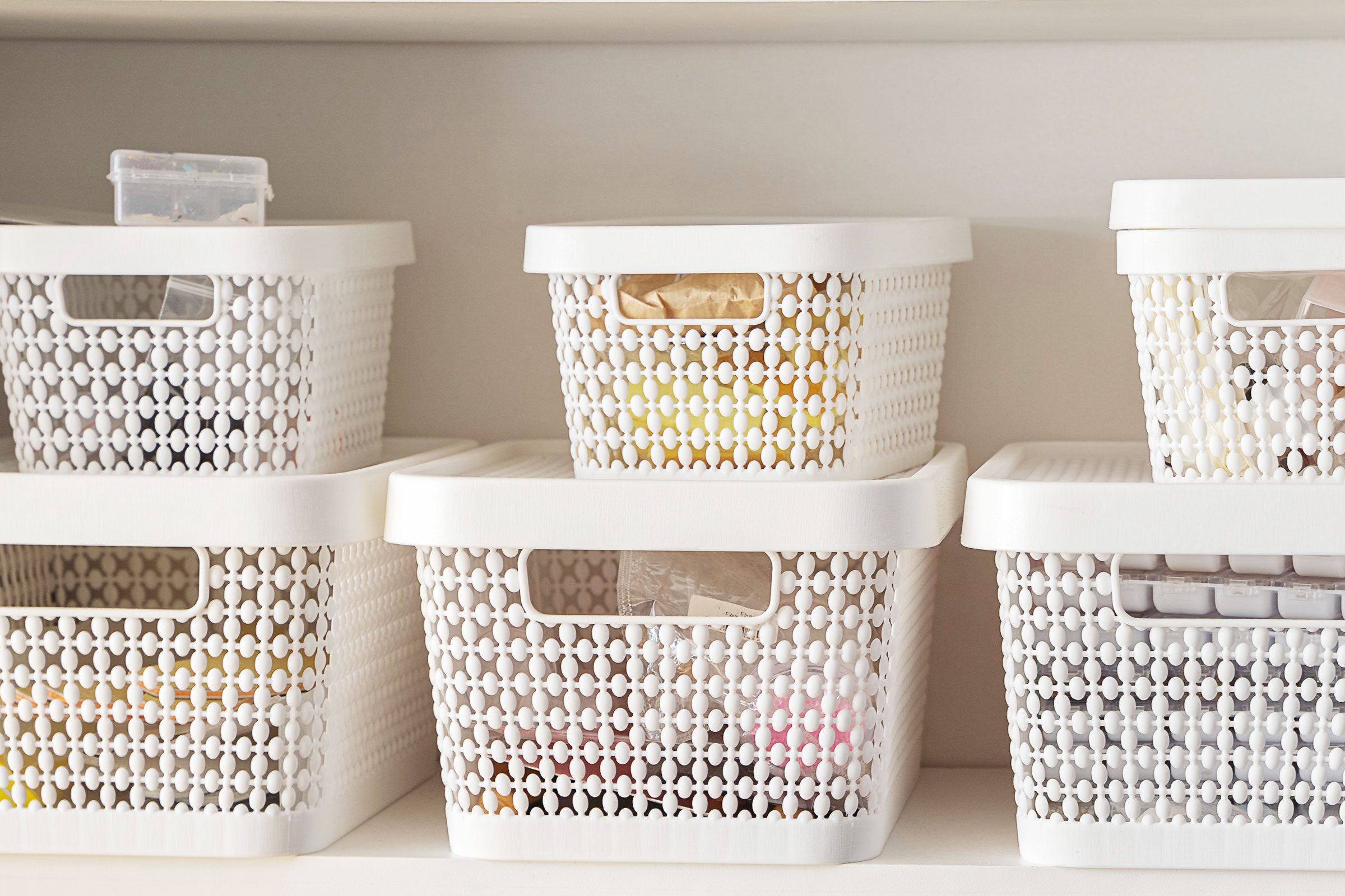 stackable white plastic bins for organizing a kitchen