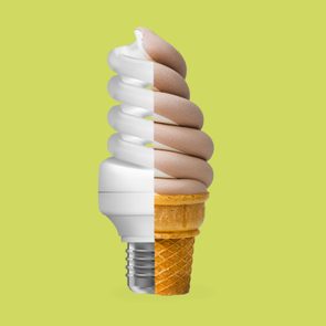 A hybrid object combines a light bulb and an ice cream cone against a plain, light green background.