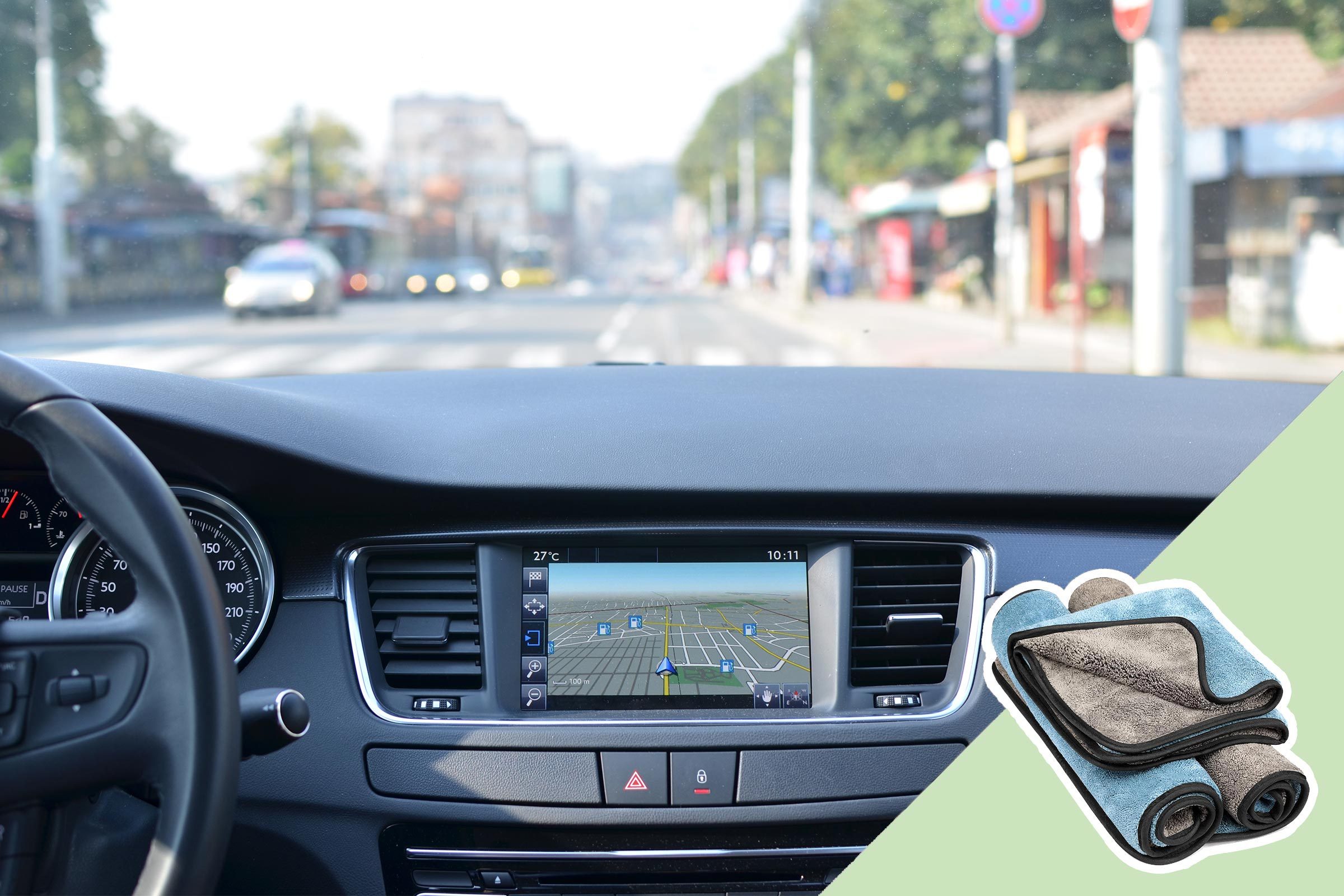 Car dashboard shows a GPS navigation screen, displaying a map, while the exterior features a busy street. Inset highlights folded microfiber towels.