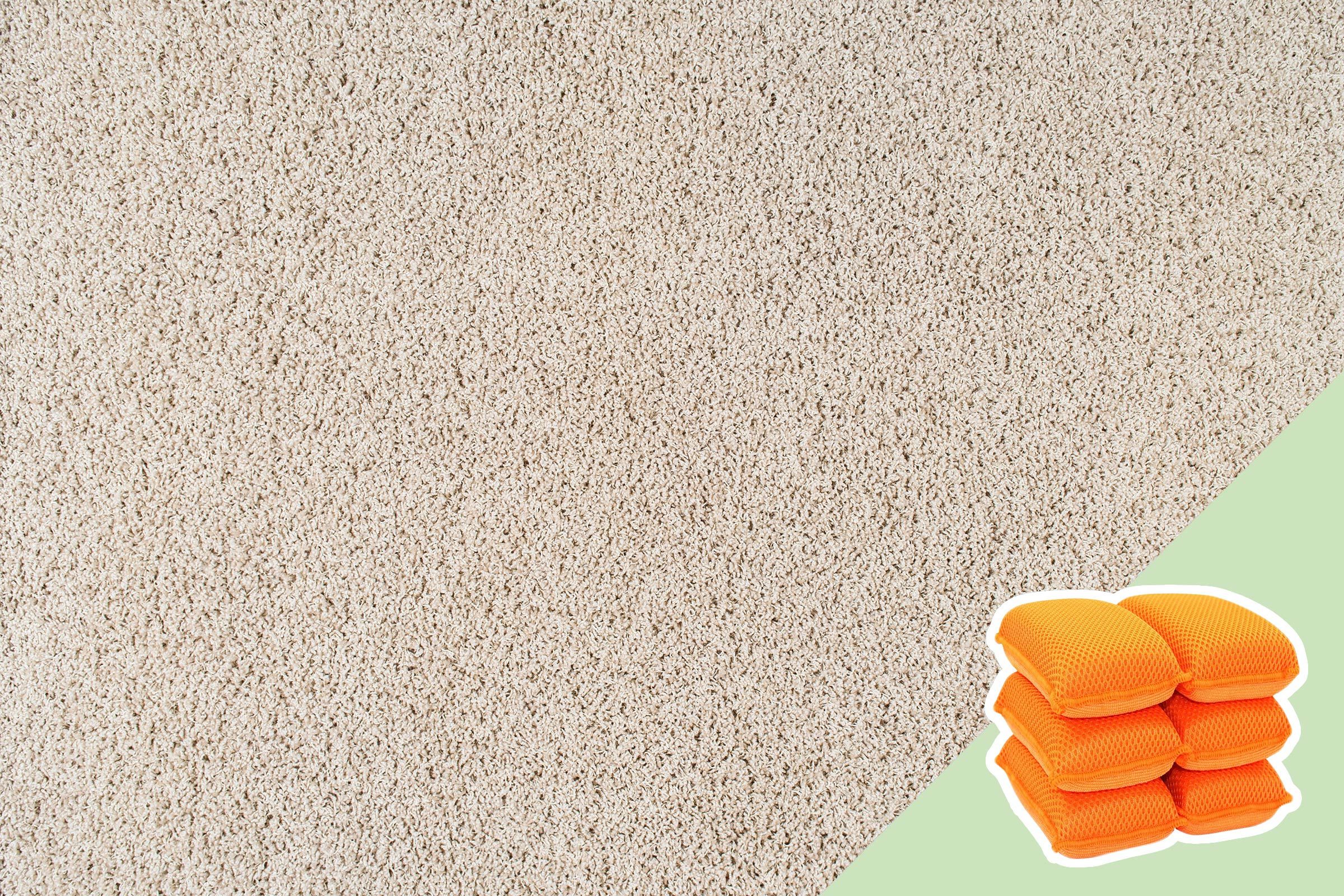 Beige carpet covers most of the image; six stacked orange cushions are in the bottom right corner, set on a light green background.