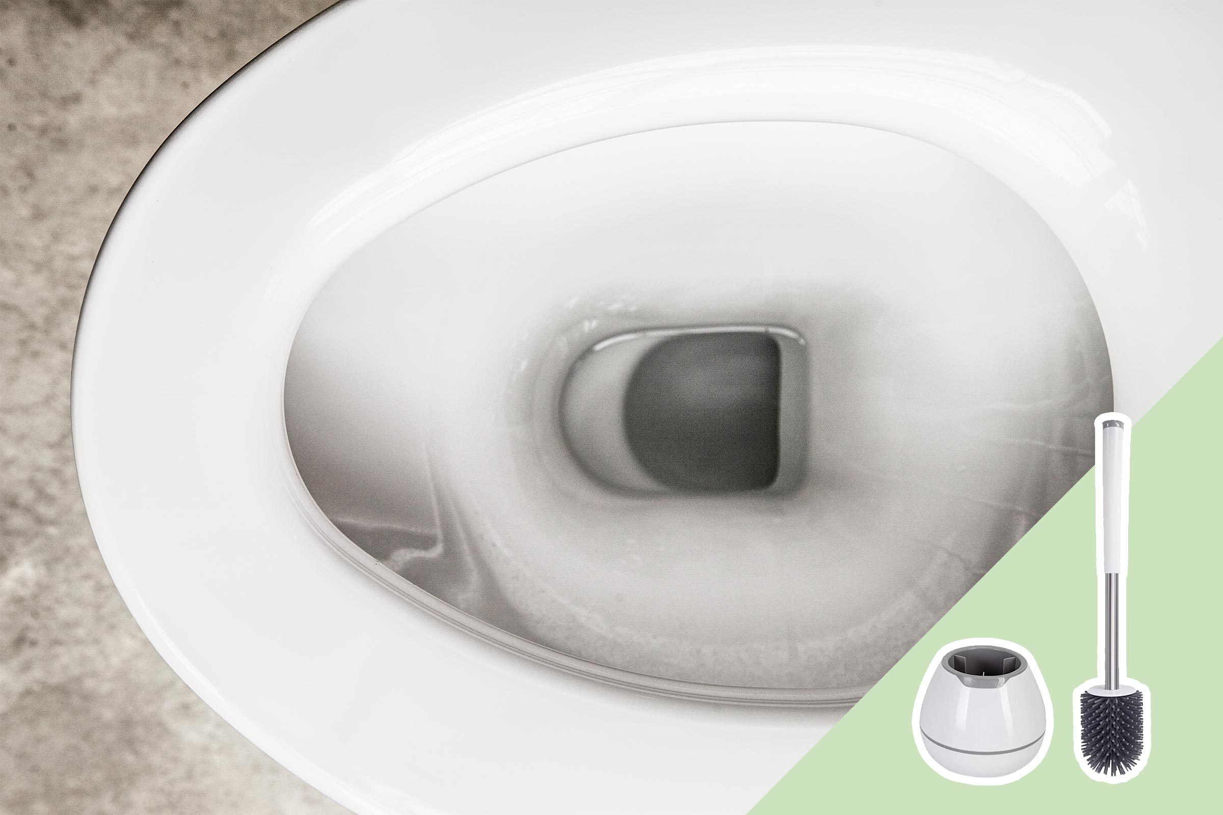 Toilet bowl seen from above, clean and gleaming; next to it, a toilet brush and holder are placed, set against a pale green background.