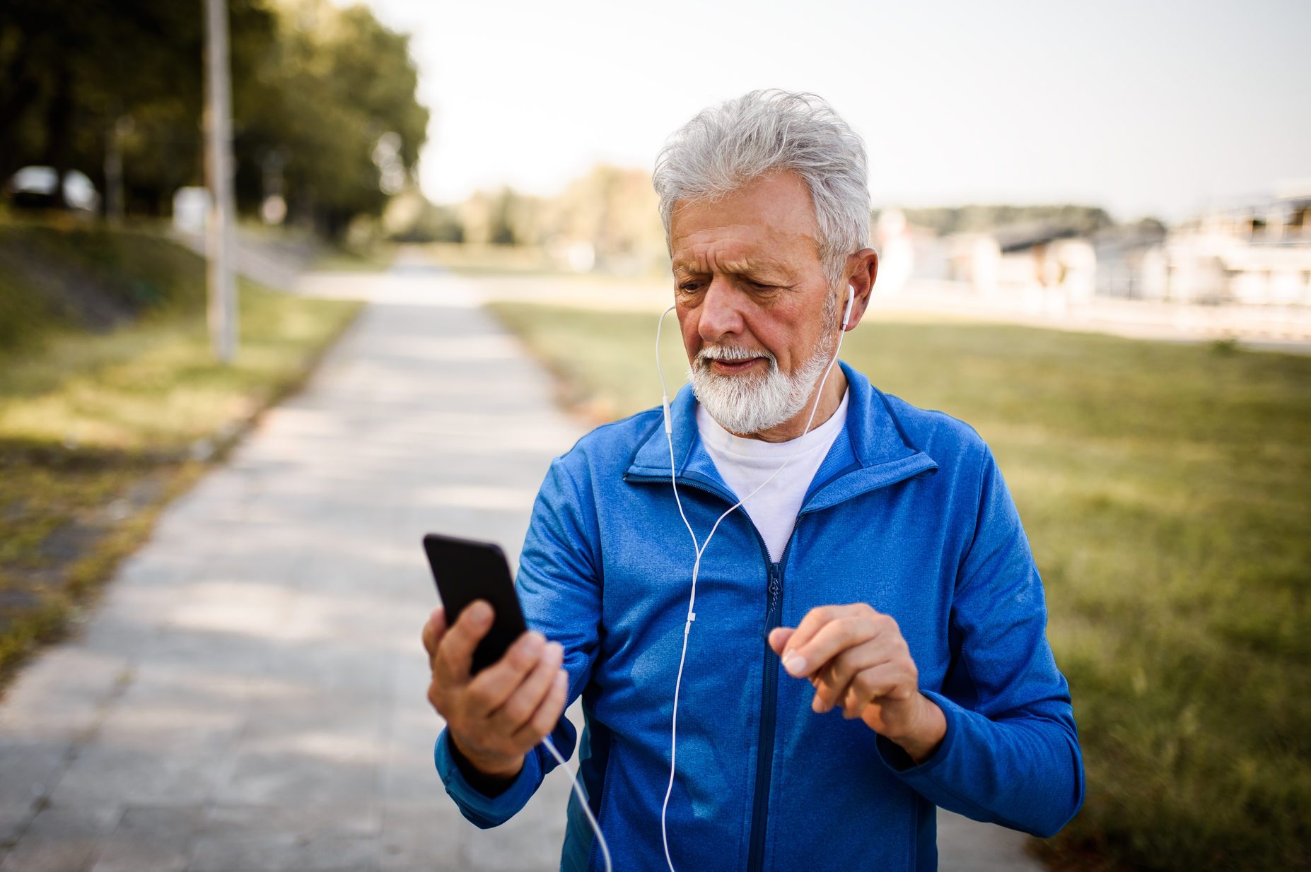 Senior man using mobile phone.