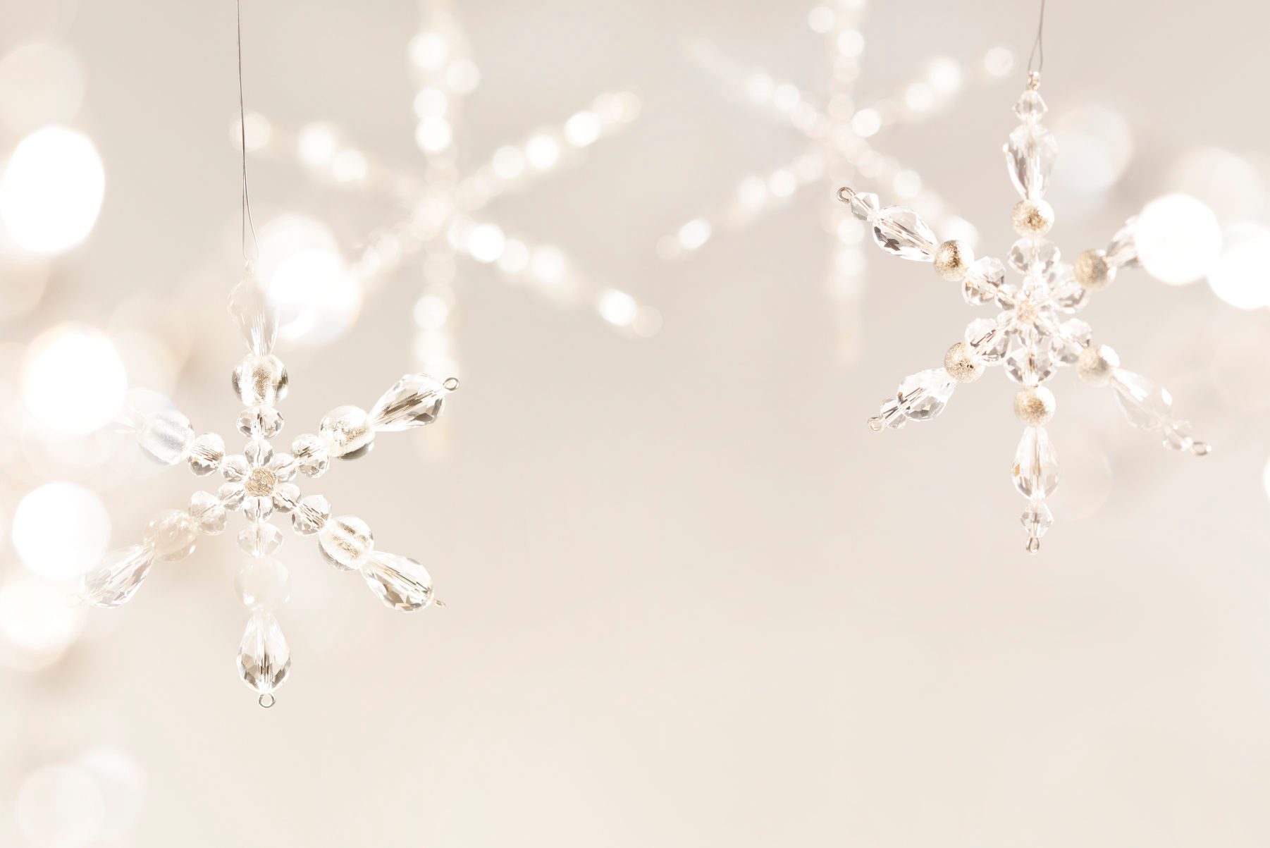 Tan Christmas background with large crystal snowflakes