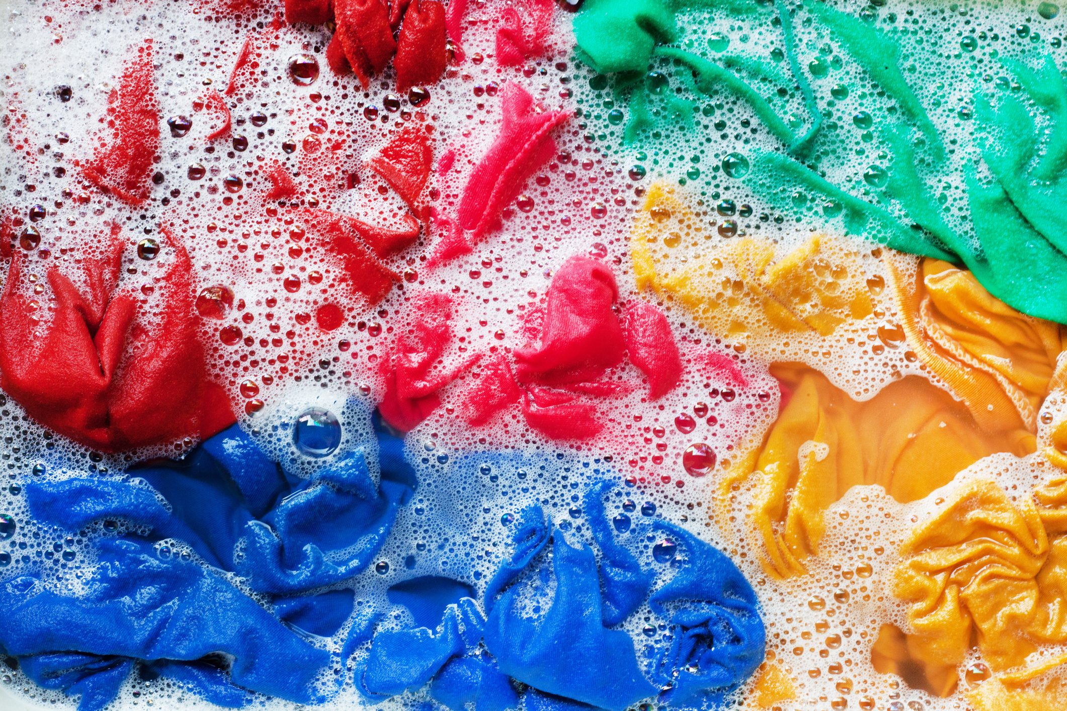 Full Frame Shot Of Multi Colored Fabric In Soap Sud