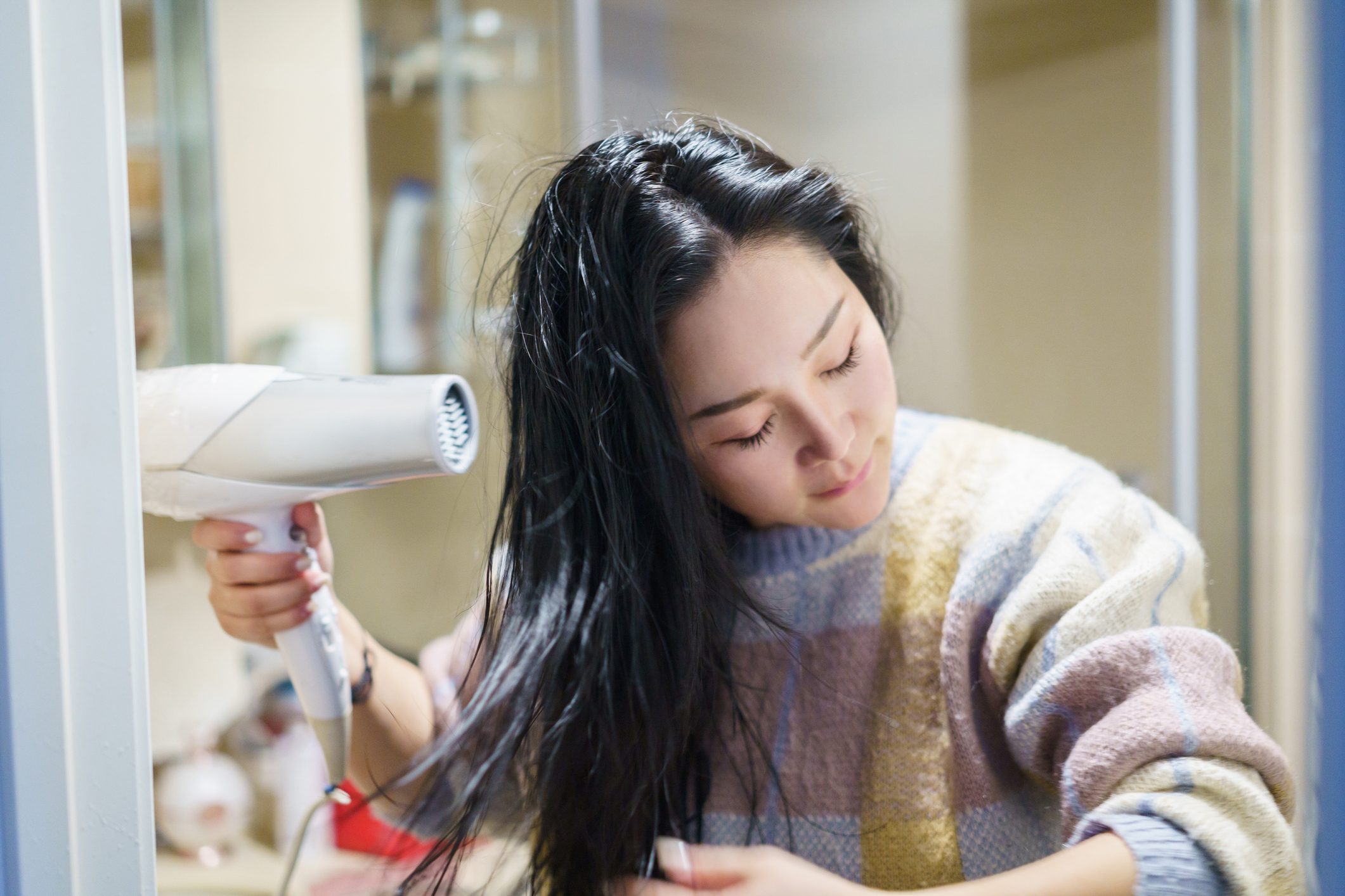 young asian female dry with blower