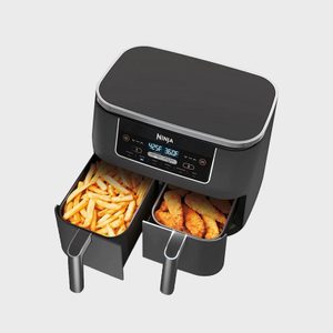 Air fryer displays fries and chicken, showcasing cooking compartments, temperature shown (425Â°F, 360Â°F) on digital screen.