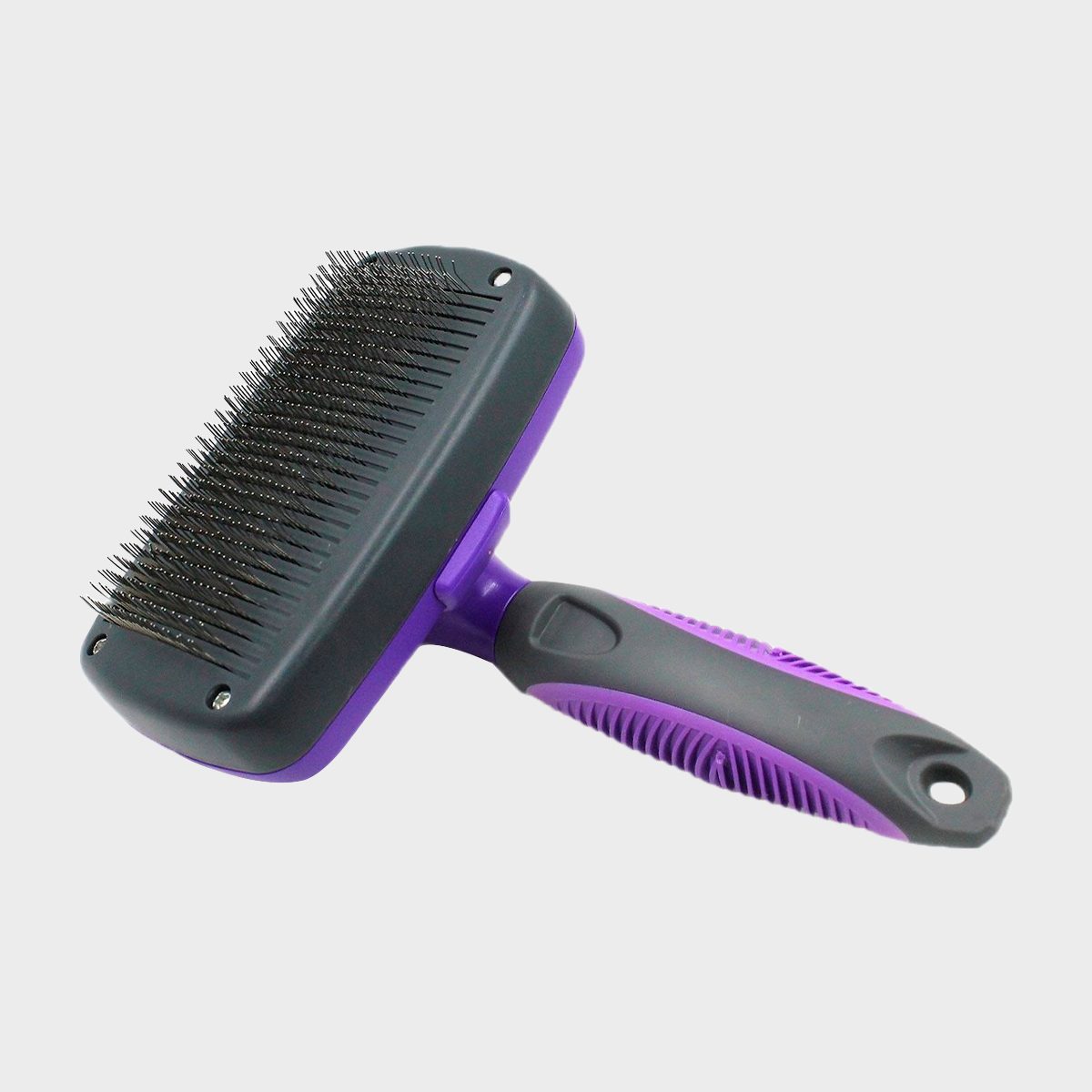 Brush with metal bristles resting against a plain background, featuring a purple and gray ergonomic handle.