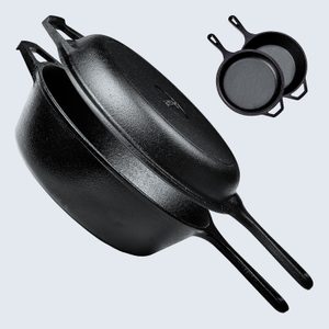 Cast iron skillets, stacked and tilting, in a simple background setting with two smaller skillets nearby.