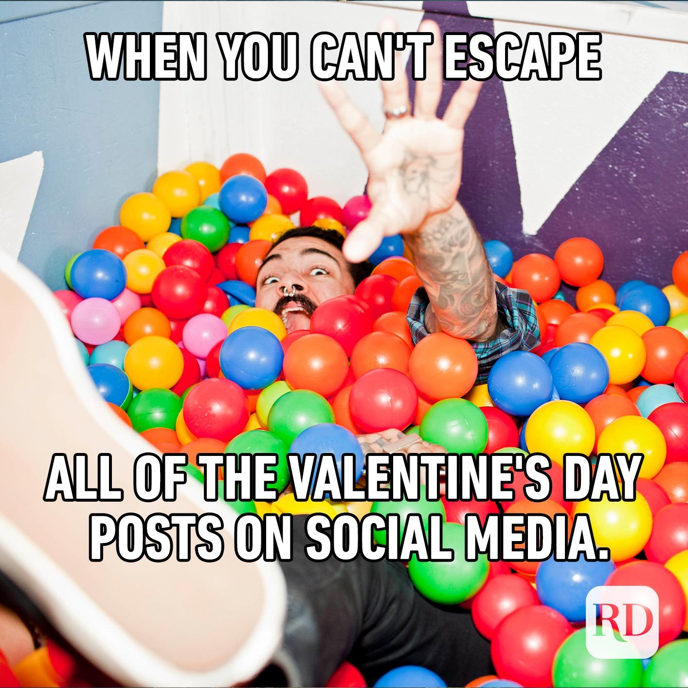 Man falling into a ball pit. Meme text: When you can't escape all of the Valentine's Day posts on social media.