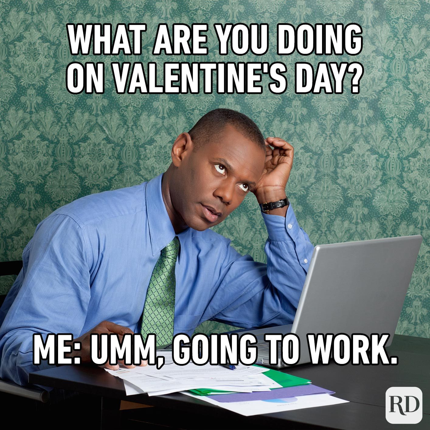 Man in office. Meme text: What are you doing on Valentine's Day? Me: Umm, going to work.