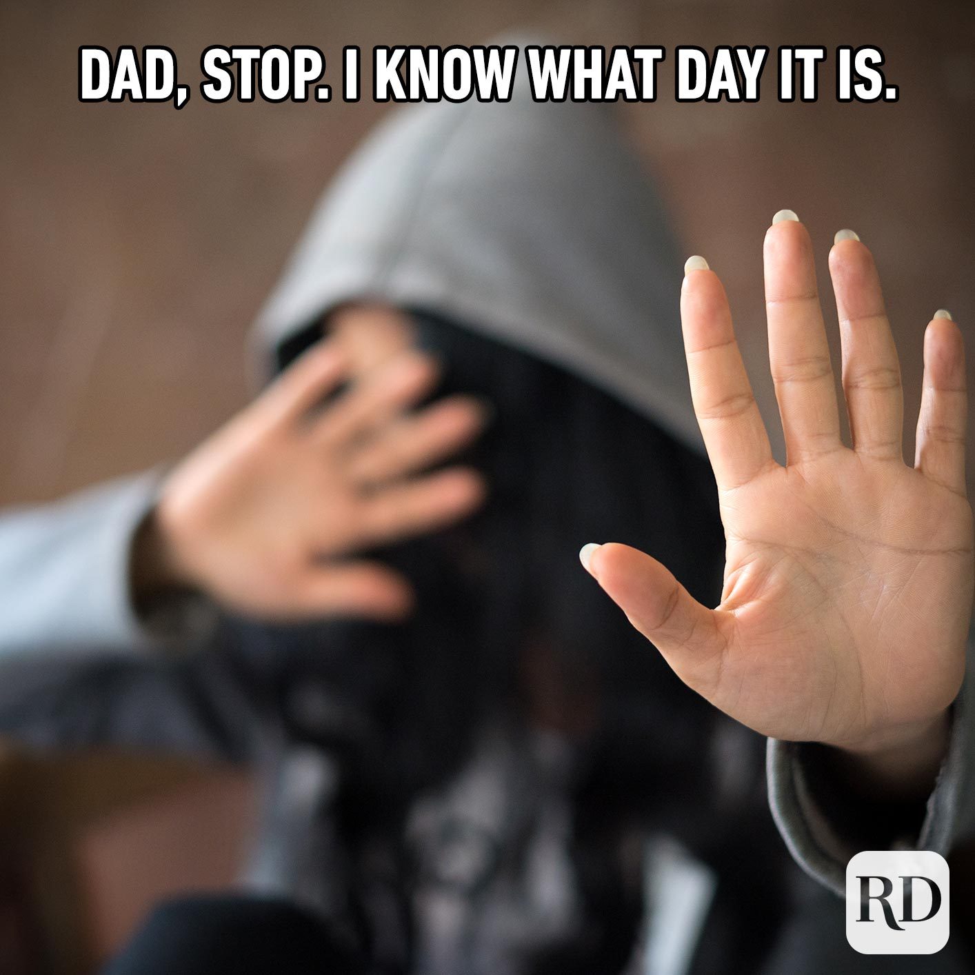 Person holding hand toward the camera. Meme text: Dad, stop. I know what day it is.