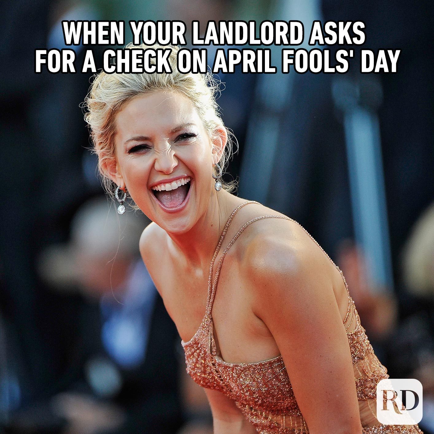 Woman laughing. Meme text: When your landlord asks for a check on April Fools' Day