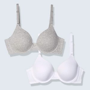 Two bras, one grey and one white, are neatly placed against a light grey background, showcasing their design and color contrast.