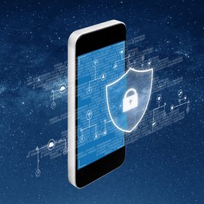 A smartphone displays a digital shield with a padlock, surrounded by binary code and technology icons, set against a starry night sky.