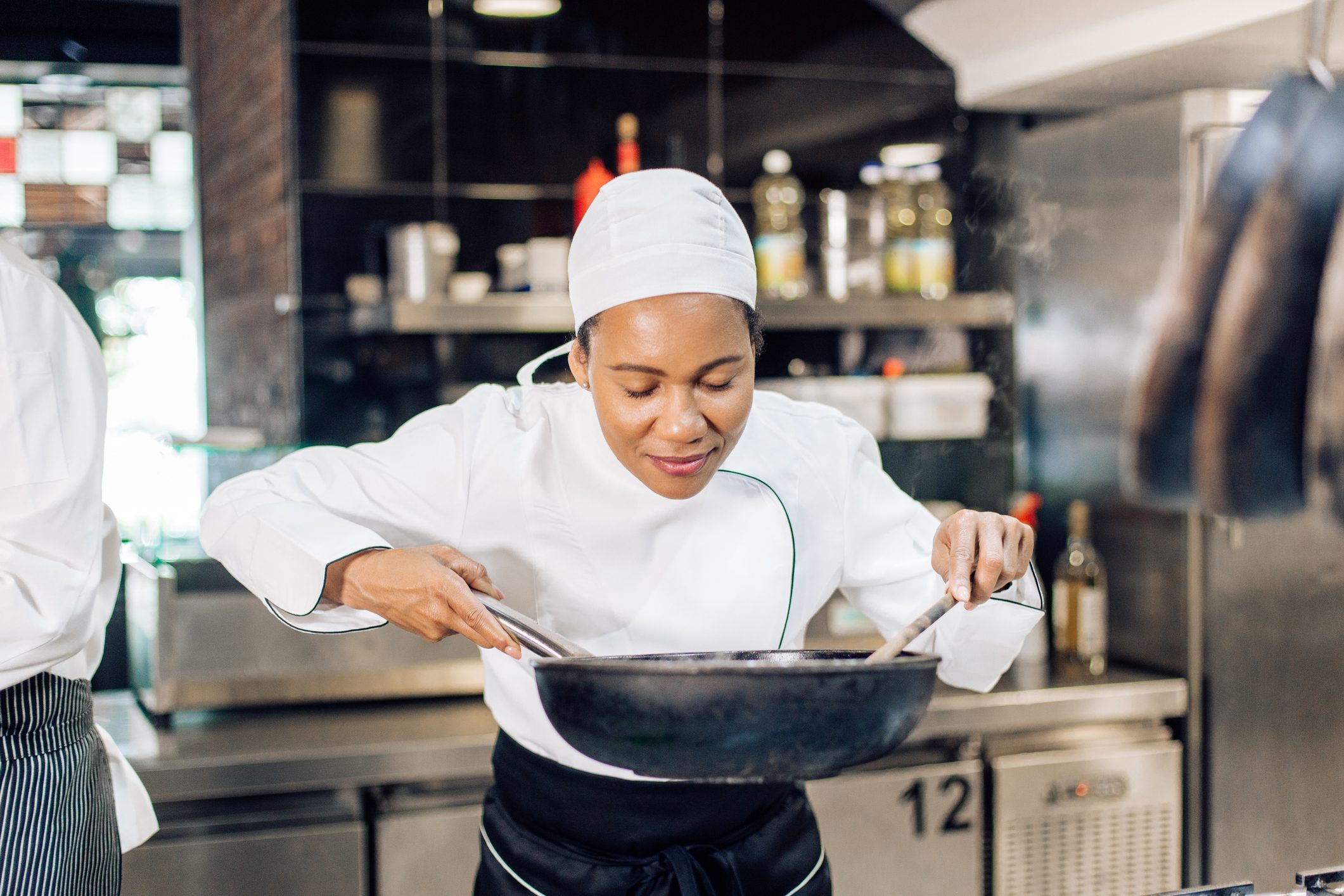 Female chef enjoying cooking
