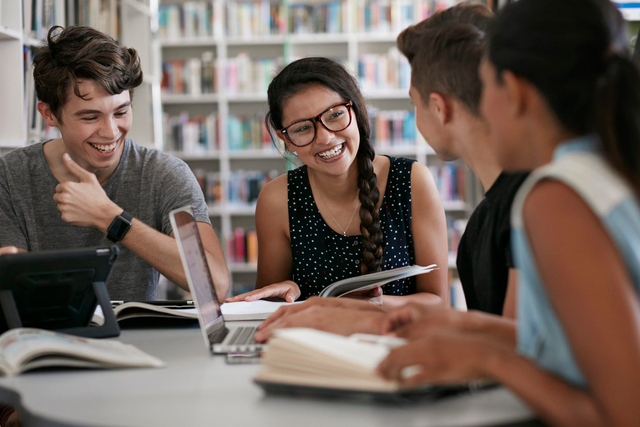 Group of students working in group & laughing